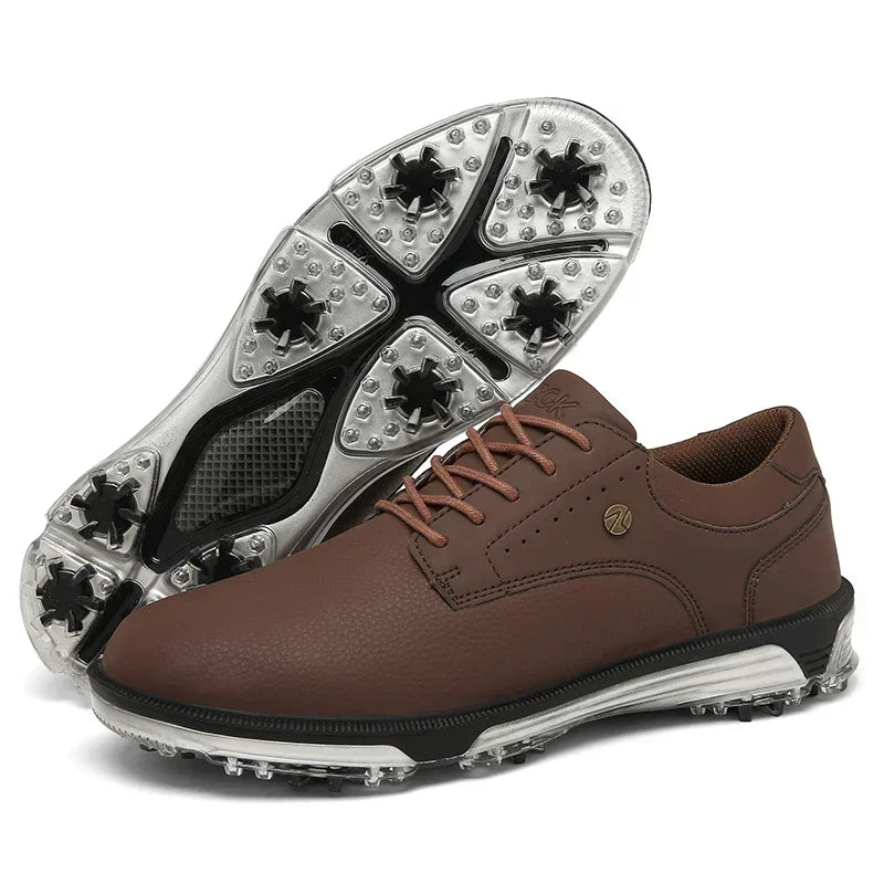 A pair of brown leather golf shoes with lace-up fronts. One shoe is upright, and the other is tilted to display the high-traction outsole designed for grip on the golf course.