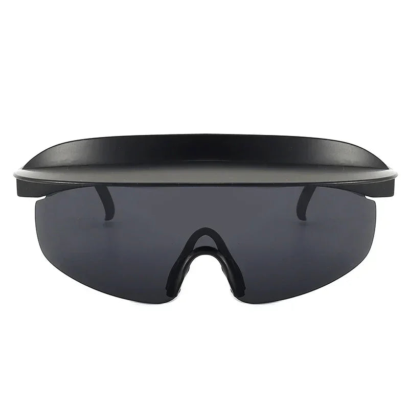 Black futuristic sunglasses with a wide, flat top shield and dark tinted single-lens visor featuring UV400 protection, viewed from the front against a white background.