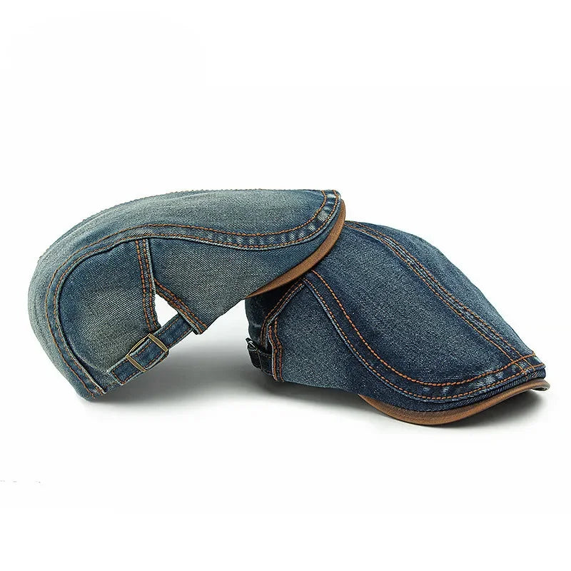 Two cotton denim newsboy caps with brown stitching and trim, one upright and the other positioned upside down, set against a white background—perfect for casual style and sun protection.