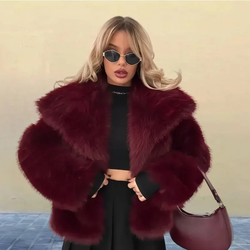 Woman in a burgundy faux fur coat, black crop top, sunglasses and purse, Rovelli fashion