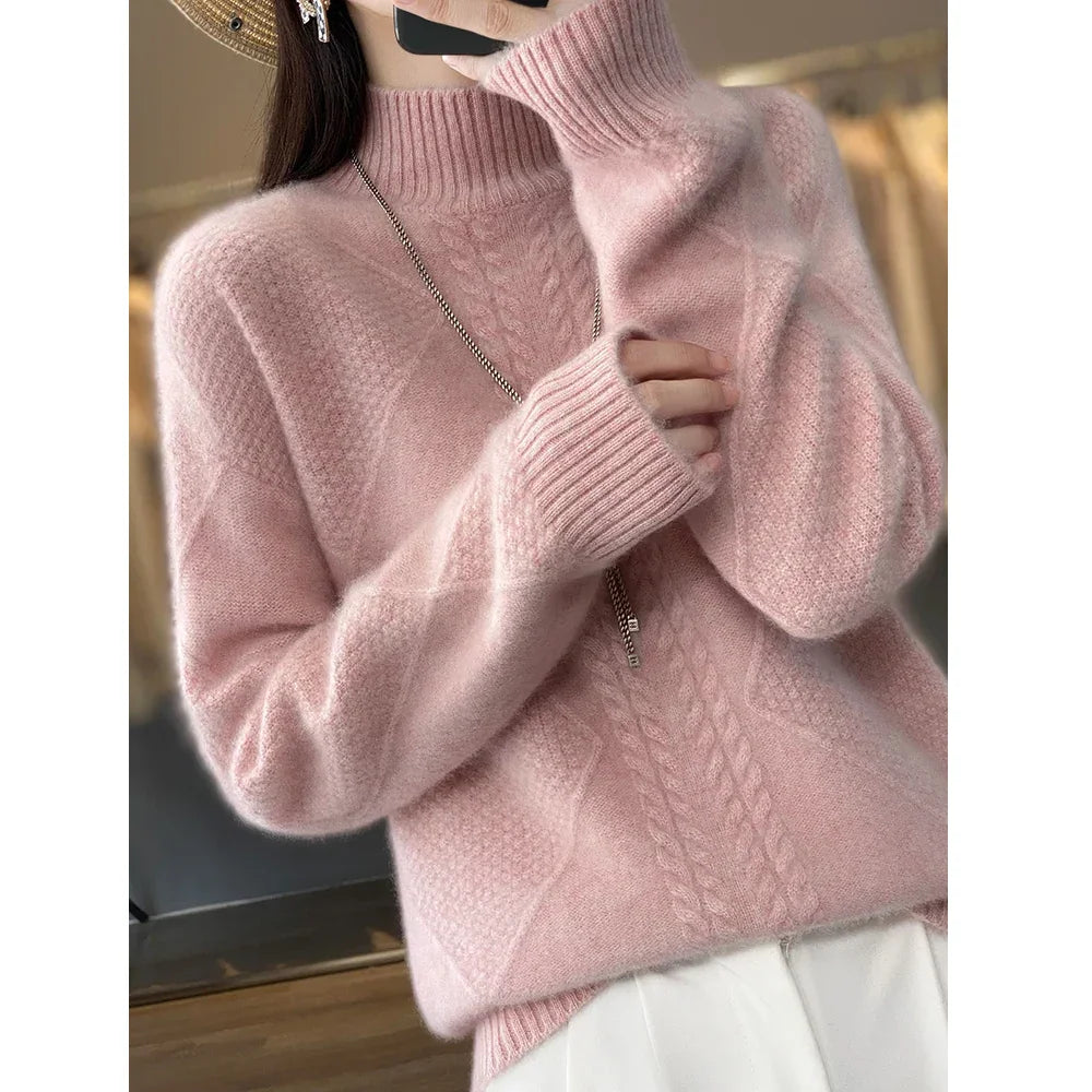 Woman wearing a soft pink cable knit sweater from Rovelli, cozy winter fashion style