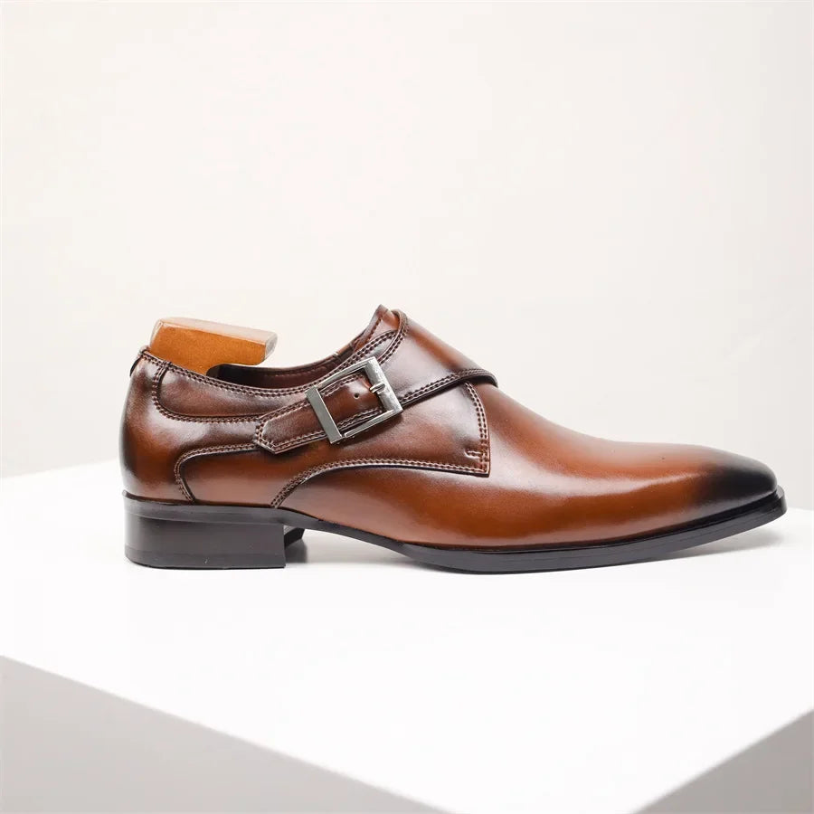 A polished brown Italian leather monk strap shoe with a silver buckle and low heel, displayed on a white surface against a plain light background.