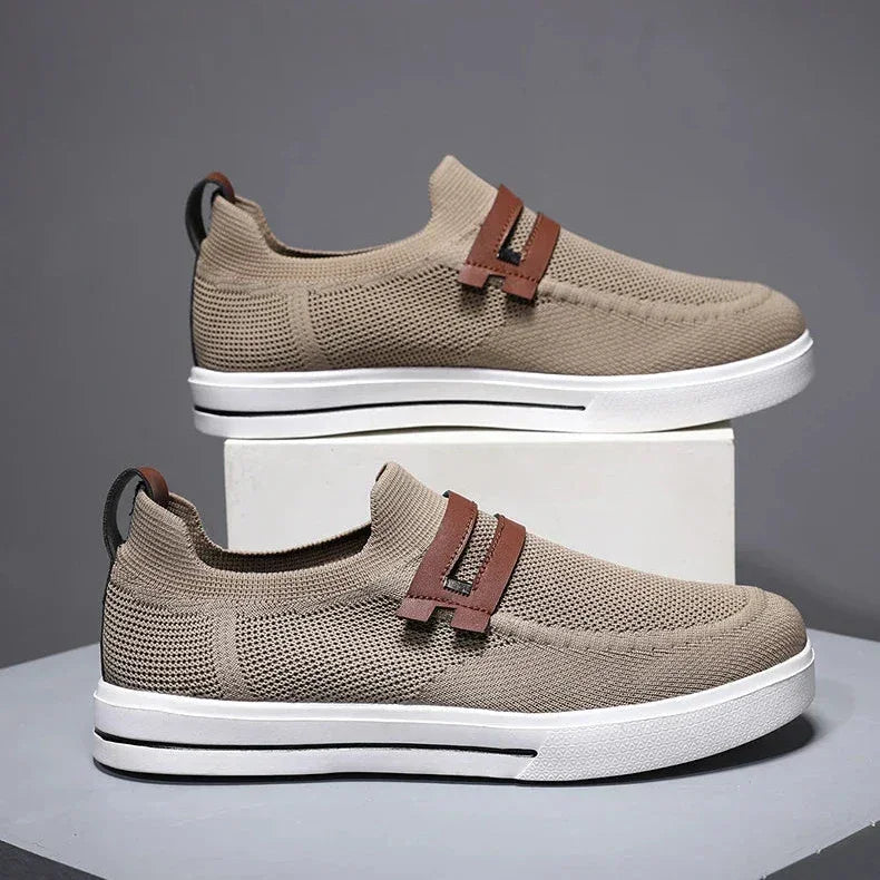 Rovelli beige knit slip-on sneakers with brown accents and white soles, studio background