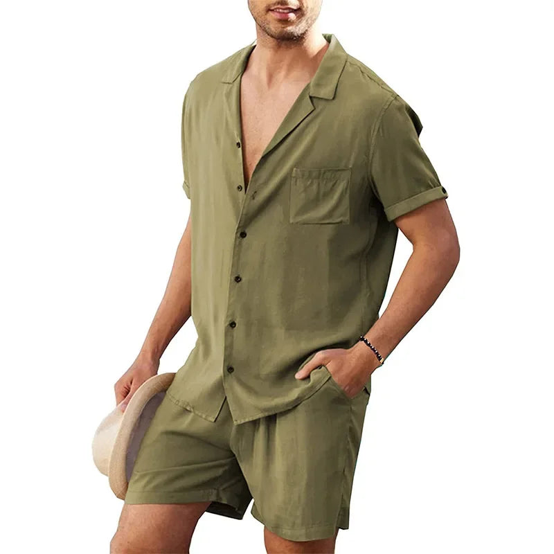 Man wearing olive green short sleeve shirt and shorts set, holding a hat, Rovelli fashion