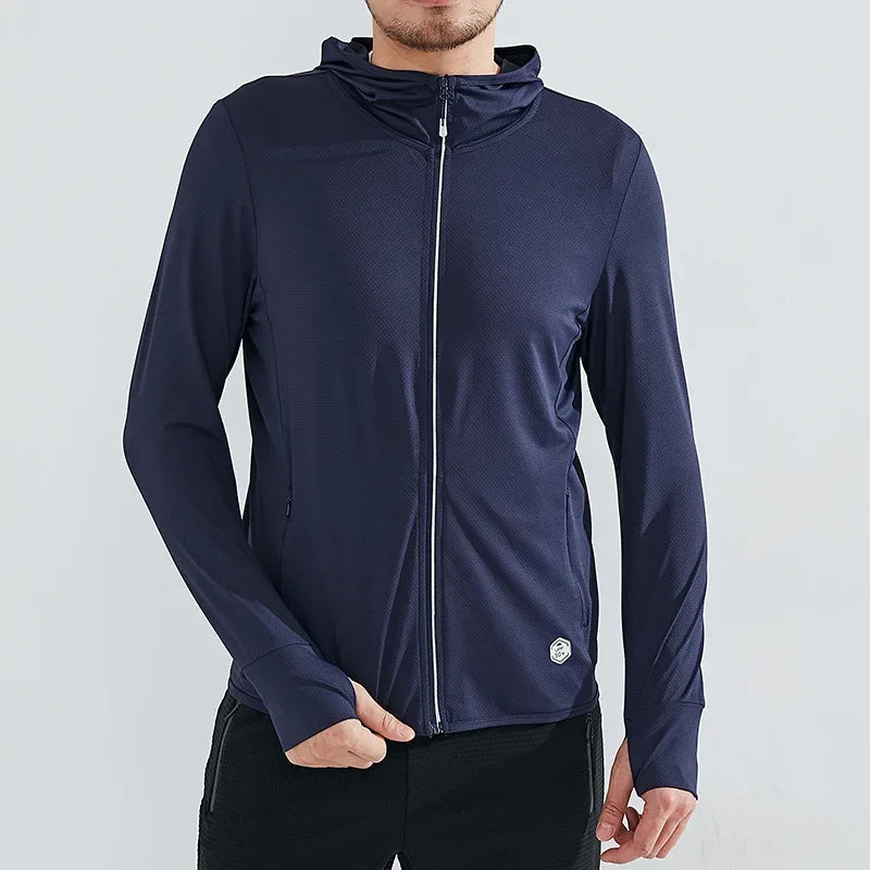 A person wearing a navy blue zip-up hoodie made of quick-drying fabric with a small circular logo near the hem, standing against a plain light background. Only the upper body is visible.