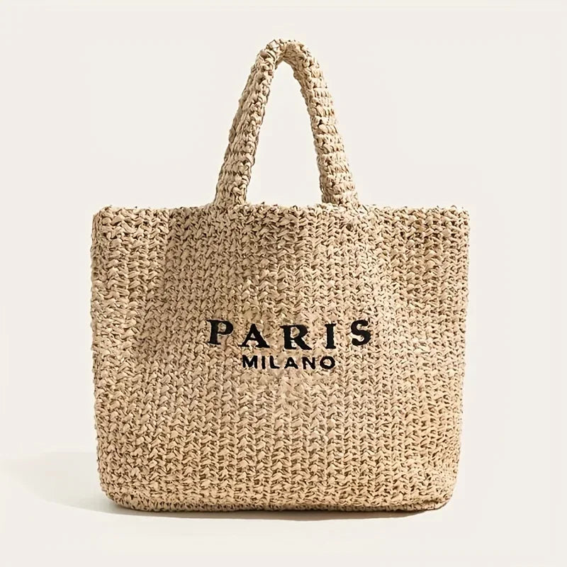 Woven straw tote bag with PARIS MILANO text, Rovelli accessory on neutral background