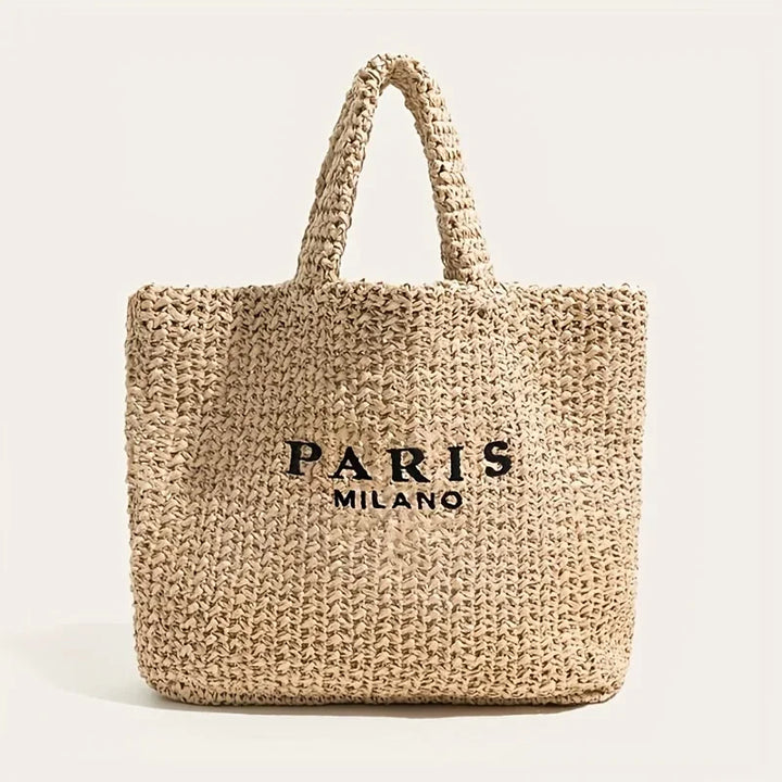 Woven straw tote bag with PARIS MILANO text, Rovelli accessory on neutral background