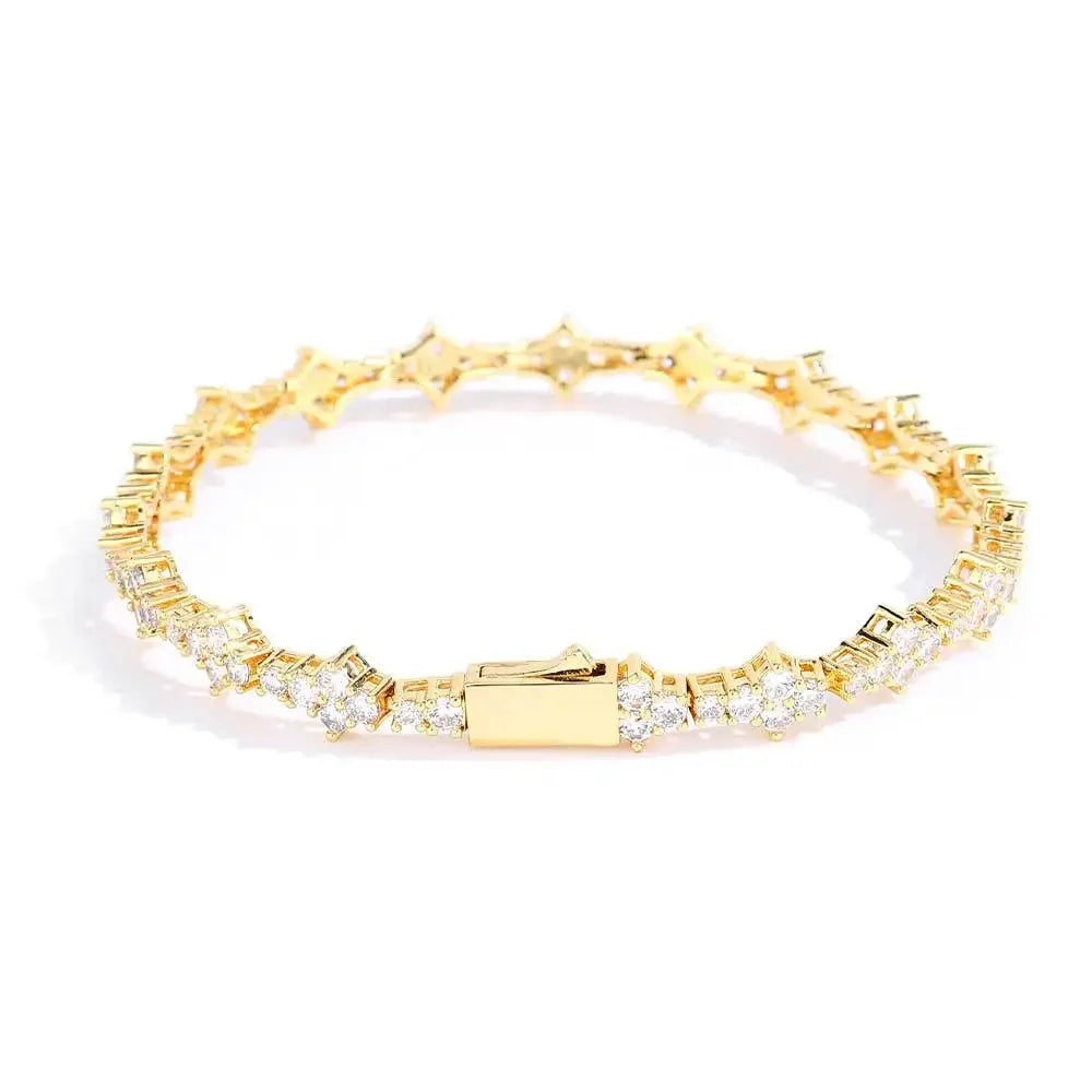Rovelli gold tennis bracelet with round and baguette diamonds on white background