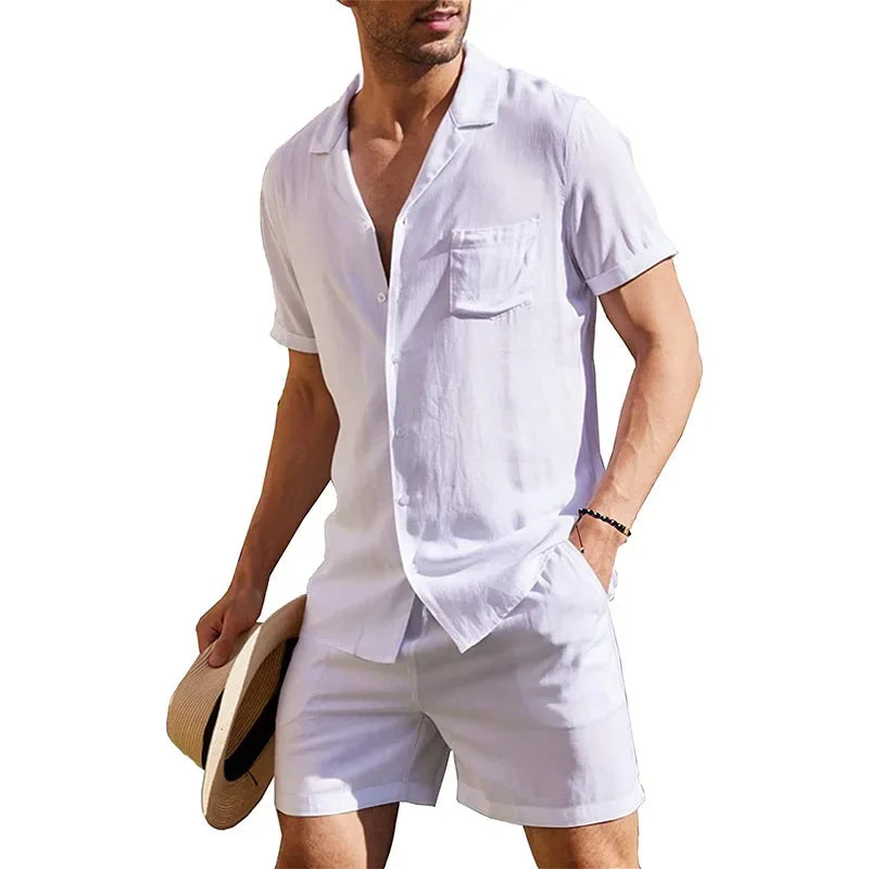 Man wearing white short sleeve shirt and shorts set, holding hat, Rovelli fashion