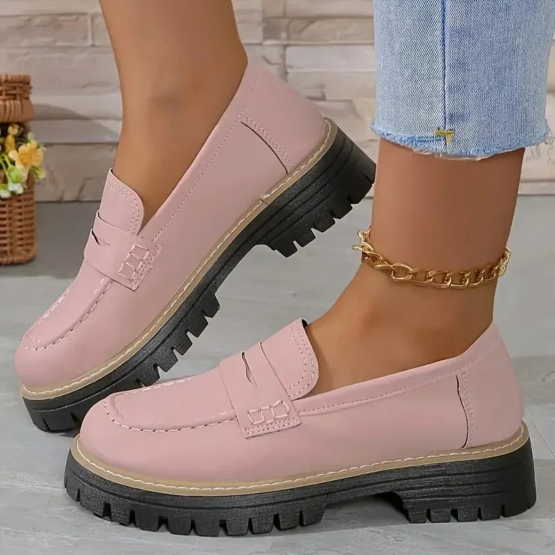 Rovelli pink chunky loafers for women with black platform sole, styled with denim jeans