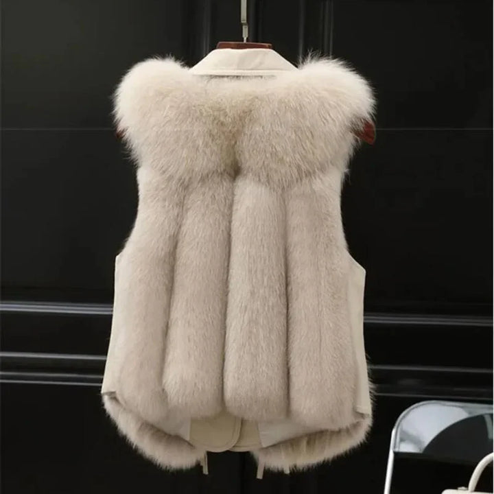 Rovelli beige faux fur vest with thick collar, hanging on black background