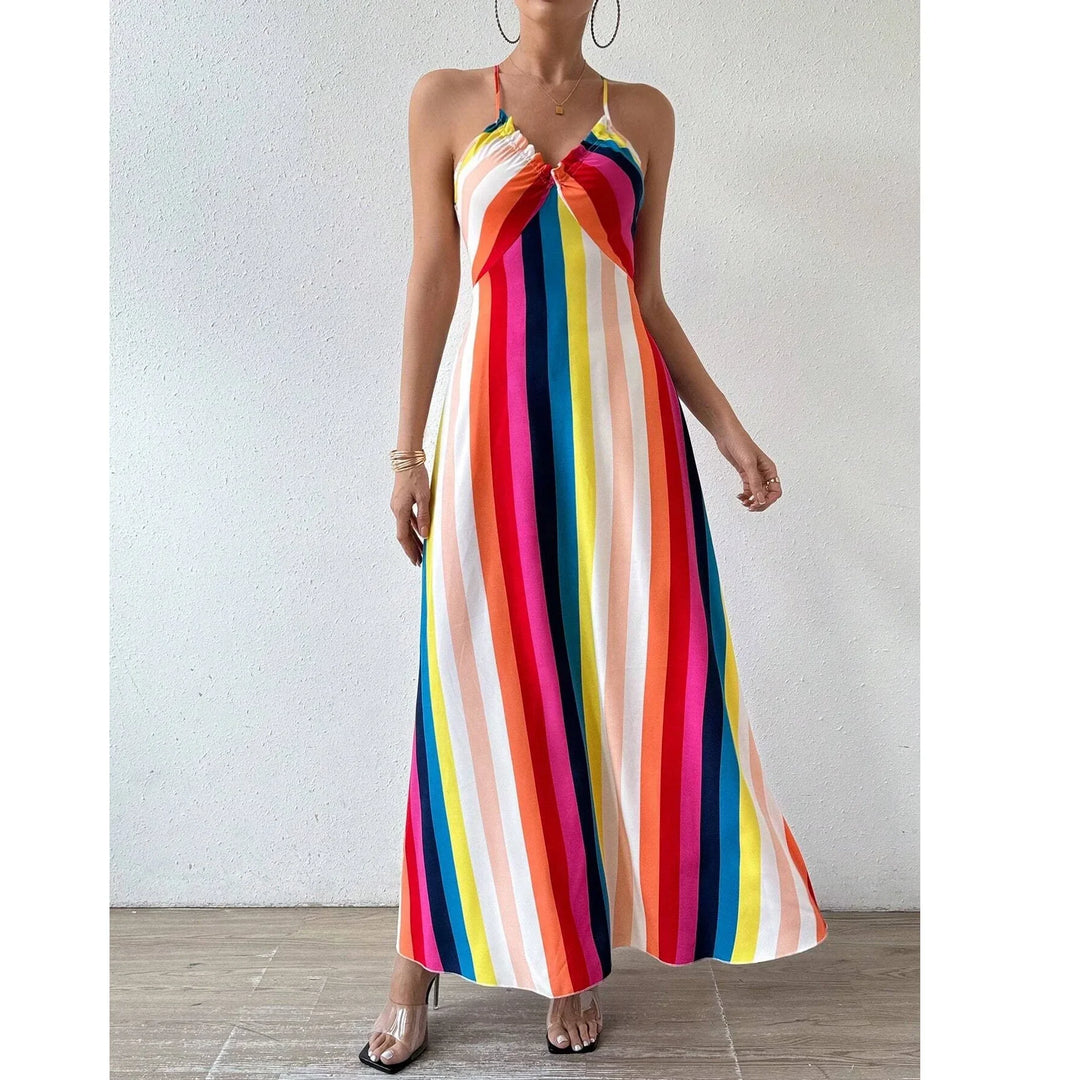 Woman wearing colorful rainbow striped halter maxi dress, fashion from Rovelli