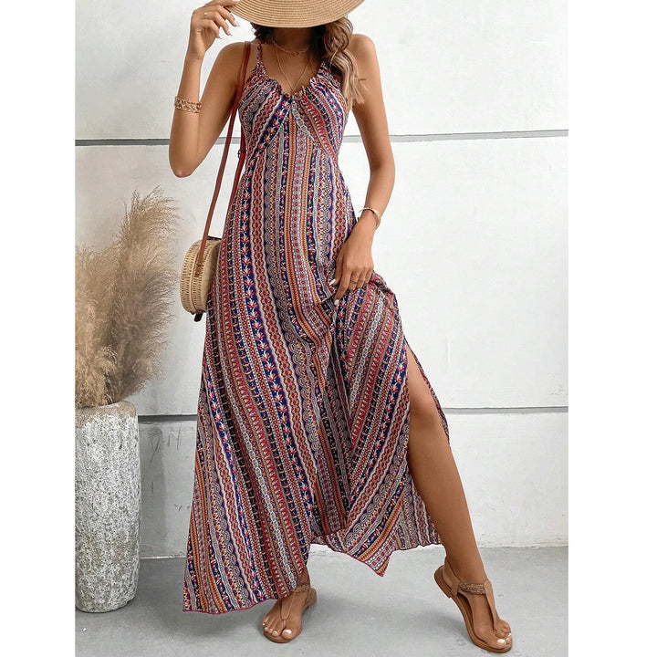 Woman wearing a patterned maxi dress and sunhat, summer fashion by Rovelli