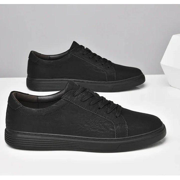 Rovelli black casual sneakers with textured finish on white background