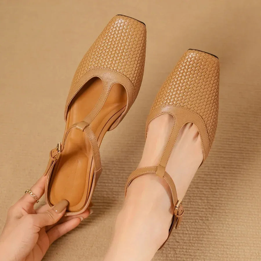 Rovelli tan woven leather T-strap flats on beige carpet, modern square toe design