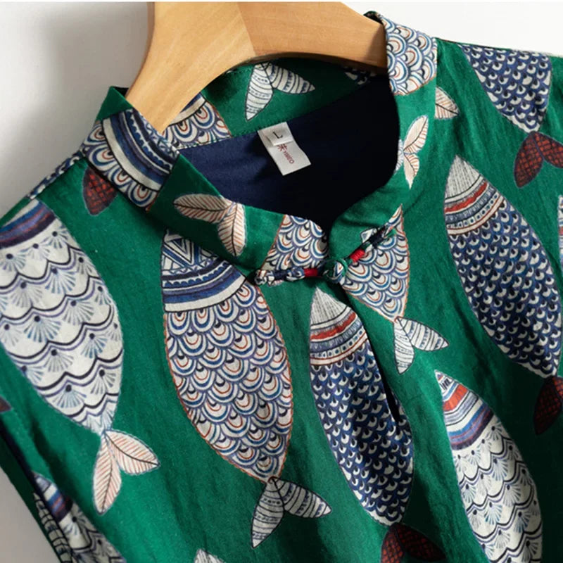 Green Rovelli shirt with colorful fish pattern and mandarin collar on hanger