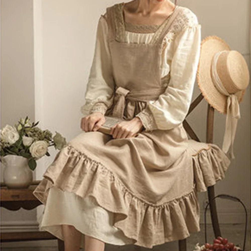 Woman in vintage beige linen dress with ruffles, sitting by flowers and straw hat, Rovelli