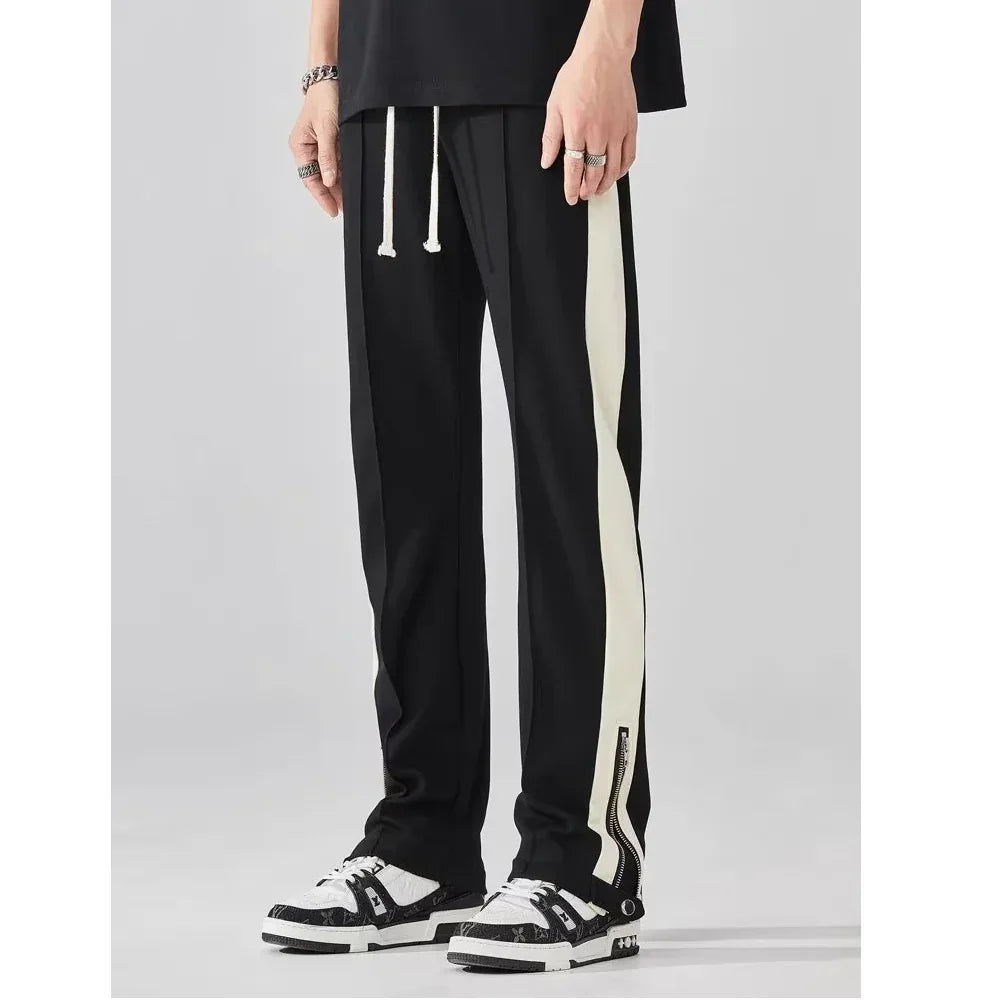 Rovelli black and white side stripe track pants with drawstring and zipper cuffs
