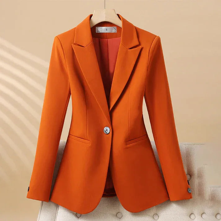 Rovelli women's orange blazer with single button, displayed on hanger against beige background