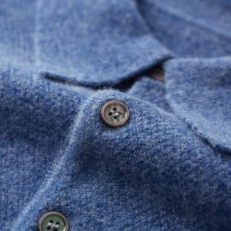 Close-up of blue wool button-up shirt with textured fabric by Rovelli