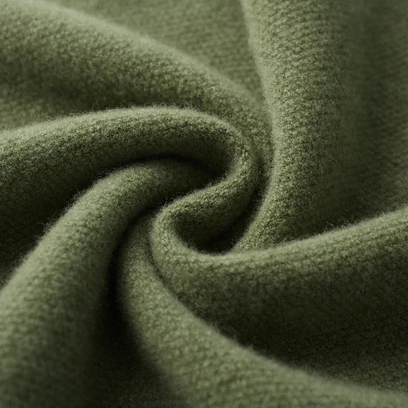 Soft olive green knit fabric close-up, textured wool material by Rovelli