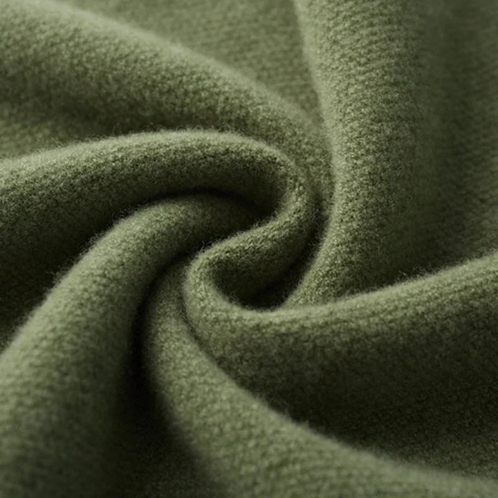 Soft olive green knit fabric close-up, textured wool material by Rovelli