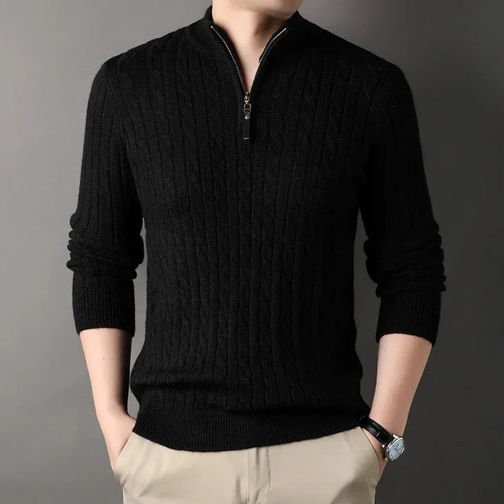 Man wearing a black cable knit zip sweater from Rovelli, hands in pockets, neutral background