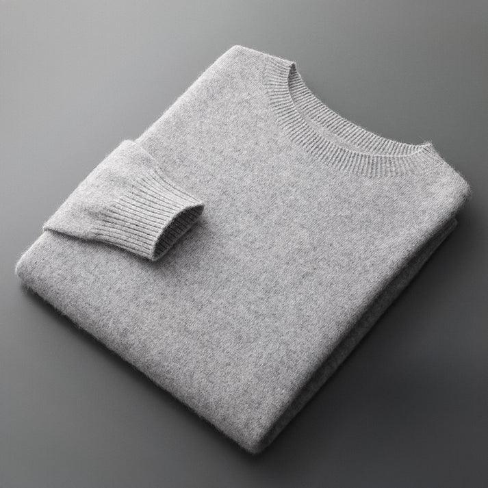 Rovelli folded light grey cashmere sweater on dark surface