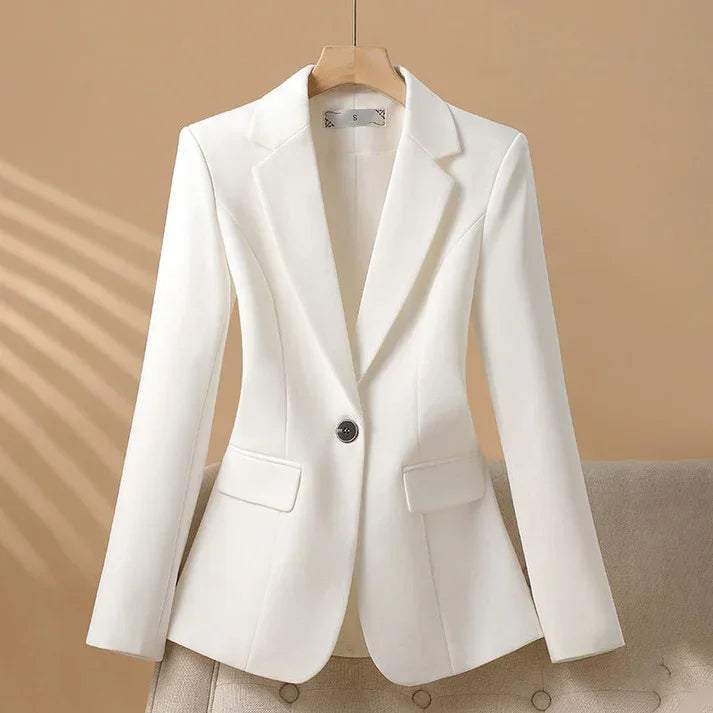 Rovelli women's tailored white blazer with notched lapel and single button on beige background