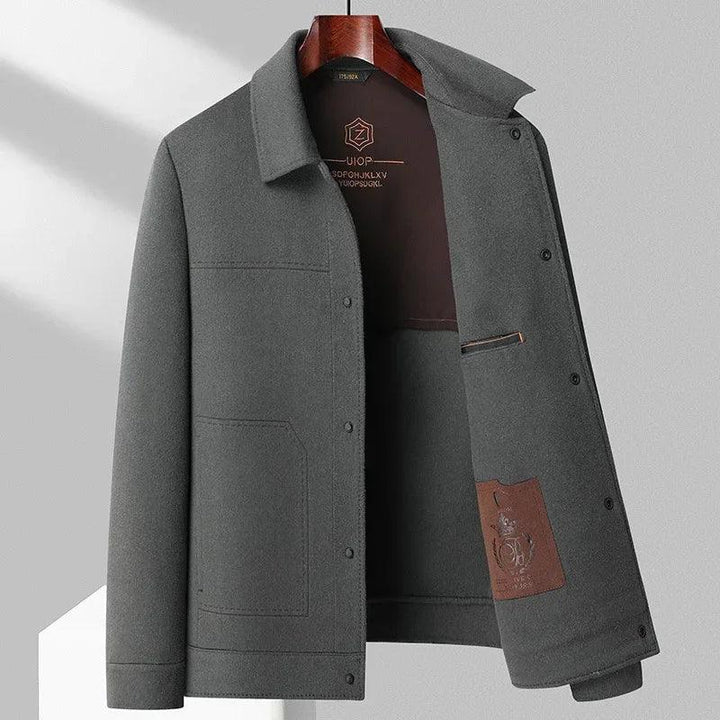 Rovelli men's grey wool jacket with large front pocket and brown lining detail on hanger