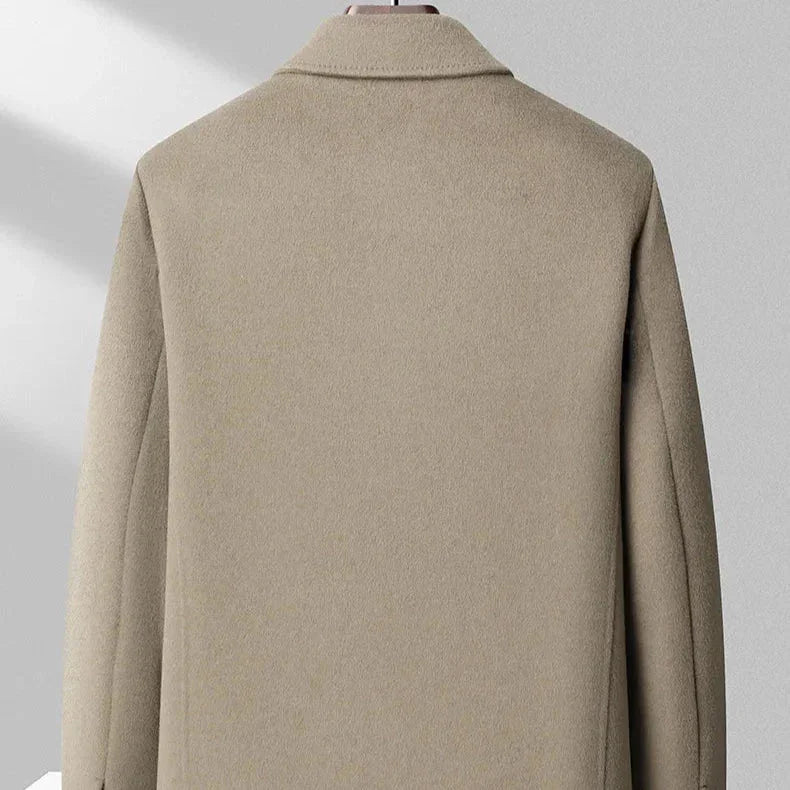 Back view of beige wool overcoat on mannequin, Rovelli clothing product photography