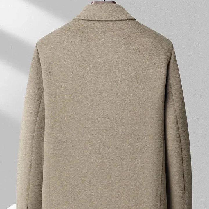 Back view of beige wool overcoat on mannequin, Rovelli clothing product photography