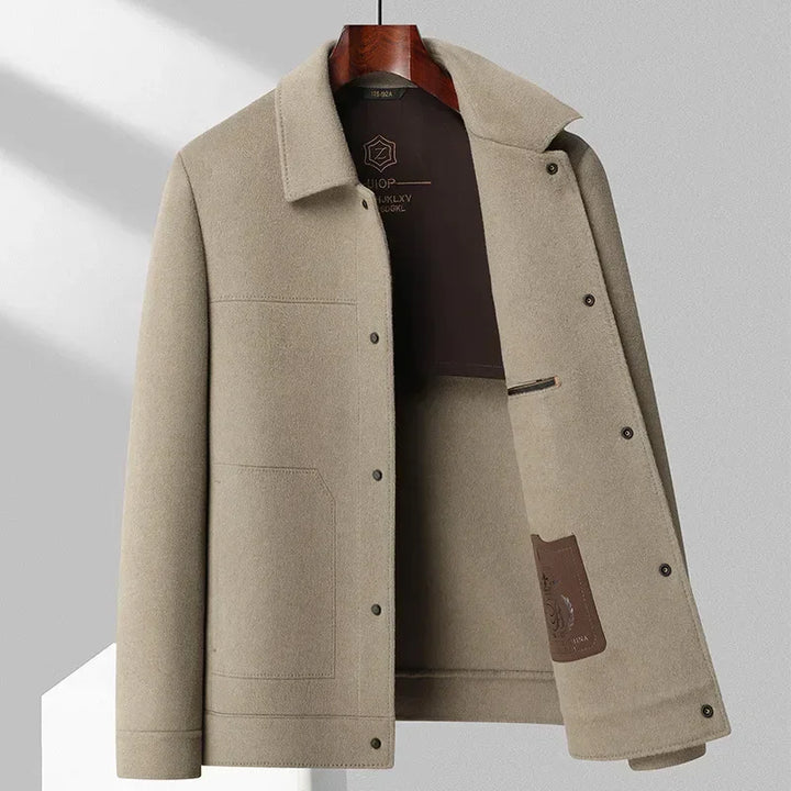 Beige wool jacket with collar and snap buttons, minimalist design from Rovelli.
