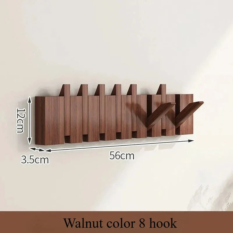 Rovelli walnut color wall-mounted 8 hook coat rack, 56cm wide with two hooks extended.