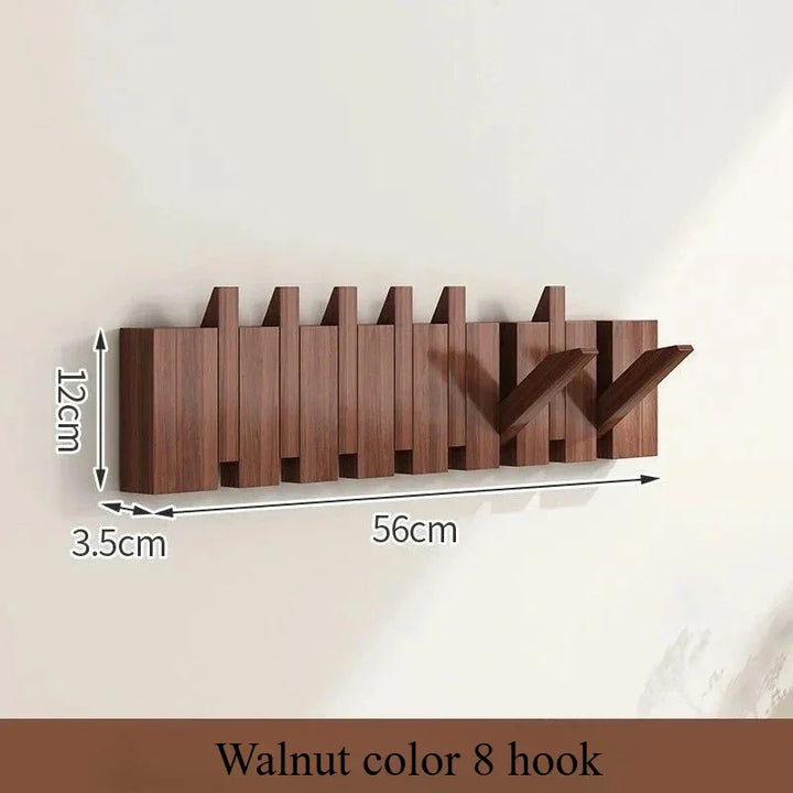 Rovelli walnut color wall-mounted 8 hook coat rack, 56cm wide with two hooks extended.