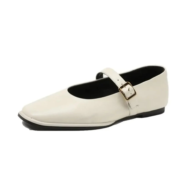 A single cream-colored Mary Jane ballet flat features a black sole and a buckle strap across the top, merging classic elegance with everyday comfort.