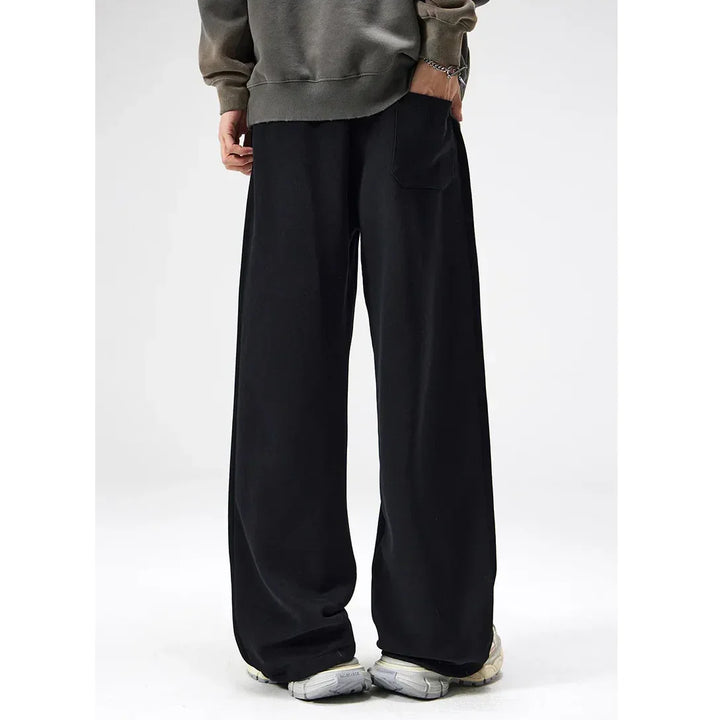 Rovelli wide leg black pants with casual sweatshirt and sneakers, modern streetwear style