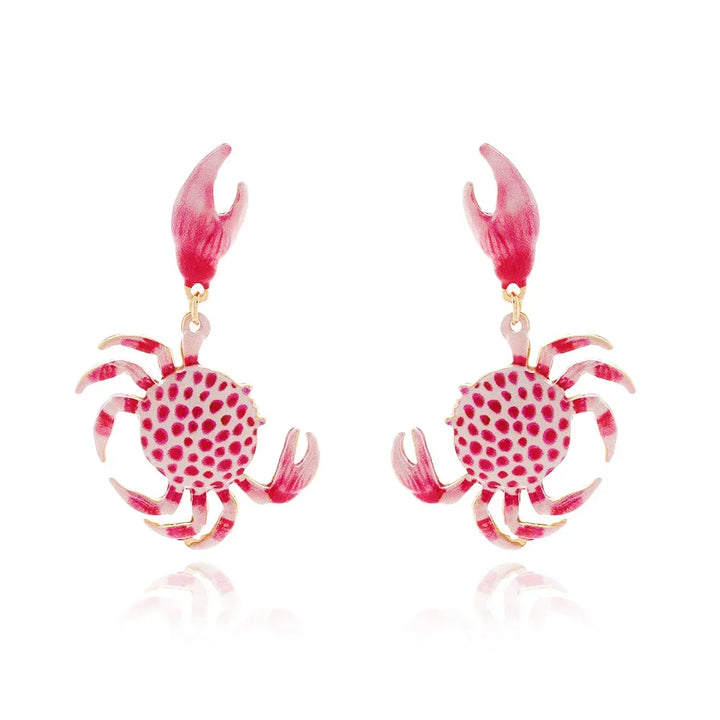 Rovelli pink crab-shaped earrings with red polka dots and detailed claws on white background