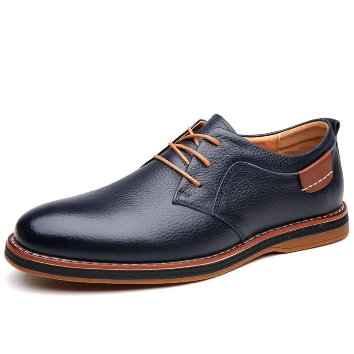 Rovelli navy blue leather dress shoe with tan laces and brown accent detail