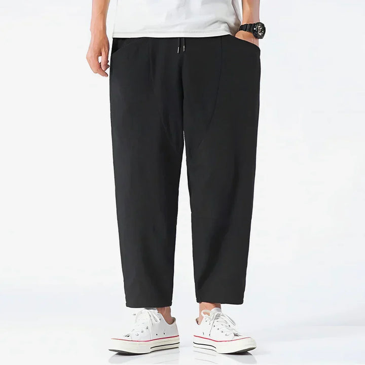 Rovelli casual black cropped pants with drawstring waist, styled with white sneakers