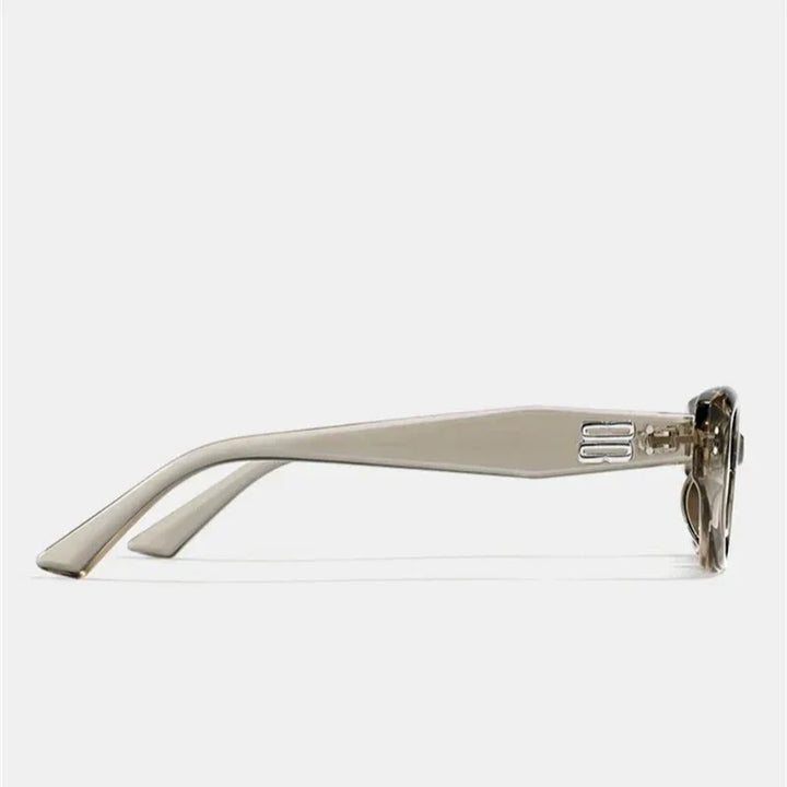 Side view of beige sunglasses with a thick, translucent acetate frame and wide arms featuring a subtle hinge detail. The lenses offer UV400 protection. Background is plain white.
