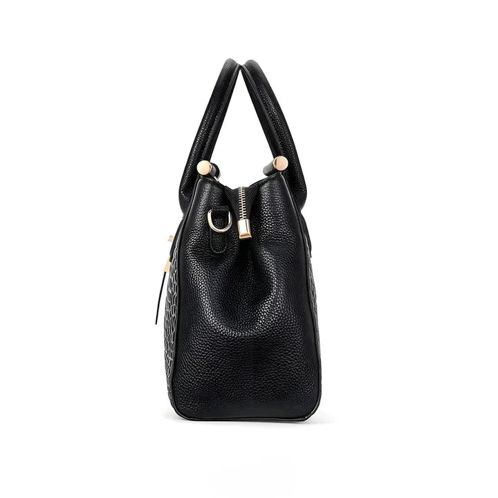 Rovelli black leather handbag side view with gold accents and textured finish