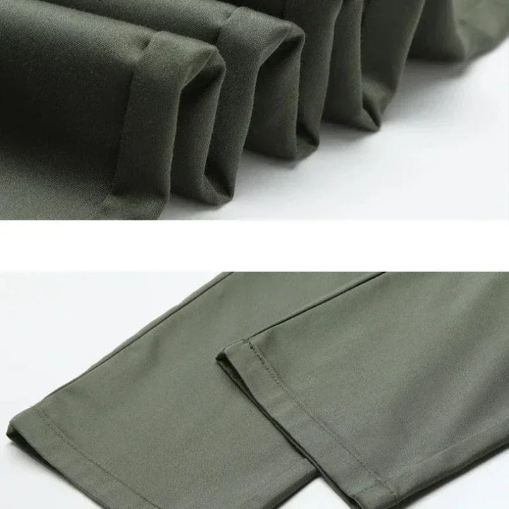 Close-up images of the hems of olive green pants, showing neat stitching and smooth fabric texture. Featuring a tailored fit, the top displays folded pant legs while the bottom shows two laid flat side by side.