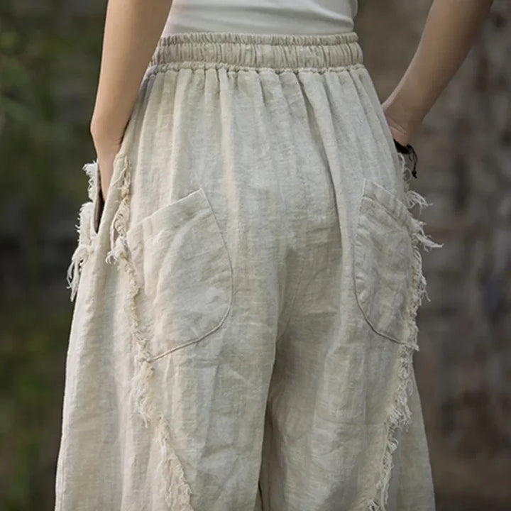 Rovelli linen pants with back pockets and frayed edges, casual outdoor style