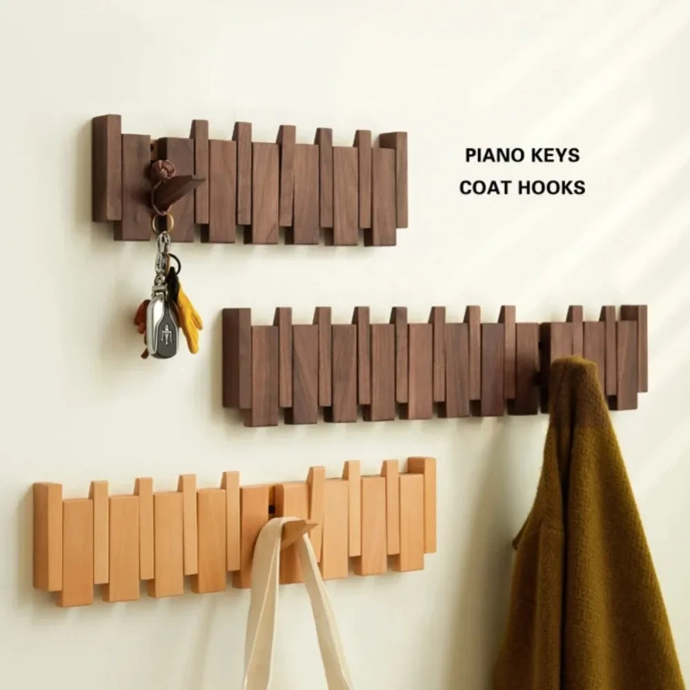 Rovelli wooden piano keys wall coat hooks with keys, bag, and coat hanging.