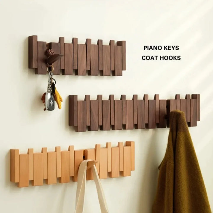 Rovelli wooden piano keys wall coat hooks with keys, bag, and coat hanging.