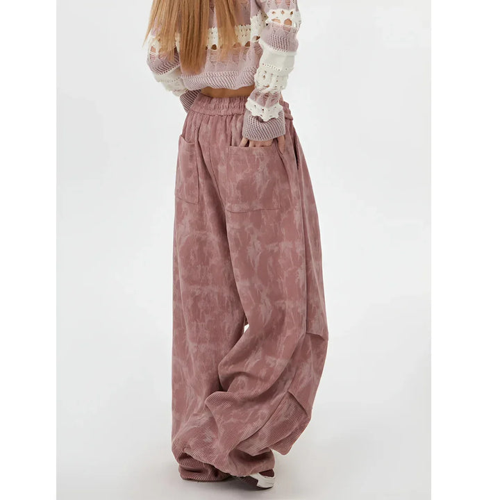 Rovelli wide-leg pink tie-dye corduroy pants with pockets, modeled in studio