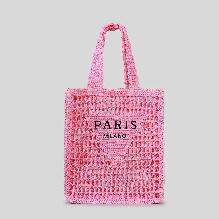 Pink woven tote bag with PARIS MILANO text, Rovelli, on a plain background