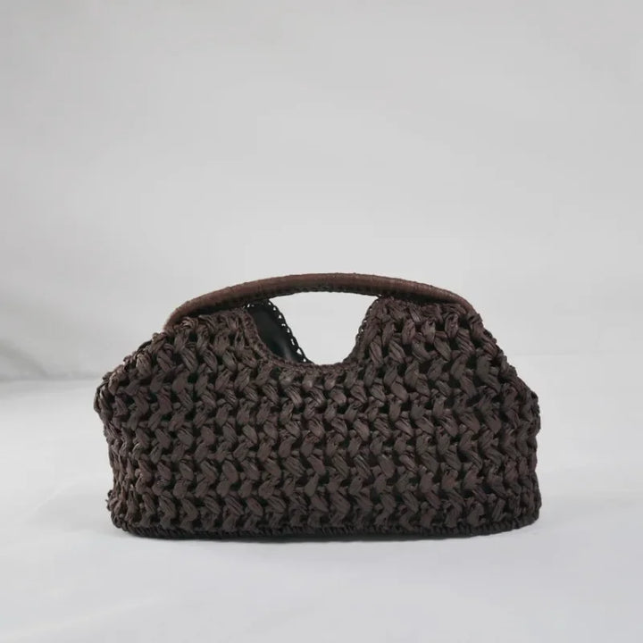 Rovelli dark brown woven handbag with cutout handle on white background