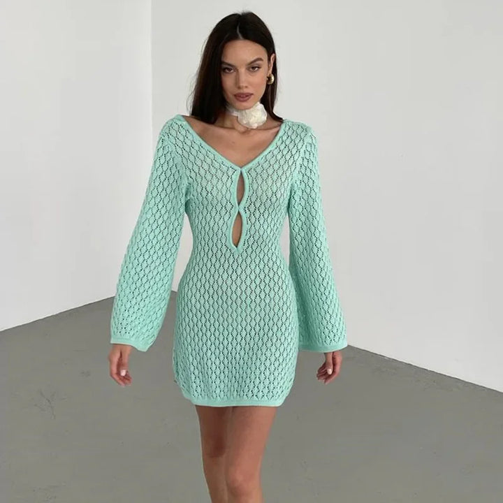 Model in mint green knit mini dress with long sleeves, keyhole front, Rovelli fashion